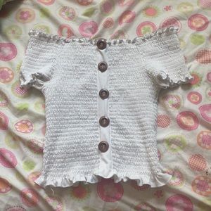 white buttoned shoulder shirt